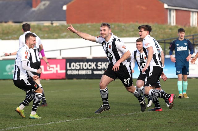 Connor Hall celebrates scoring Chorley's opening goal against Derby.