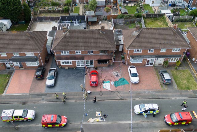 Emergency services at the scene of a house fire