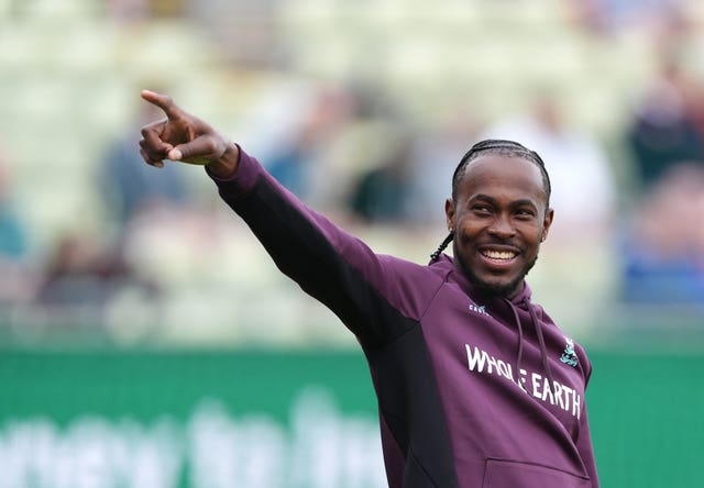 Jofra Archer points to his left in an England training session.