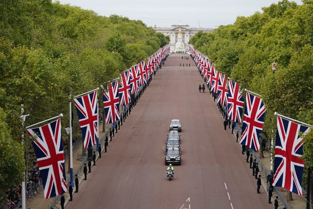 King Charles III motorcade is driven along The Mall in central London 