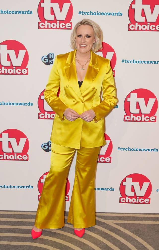 A woman in a bright yellow suit