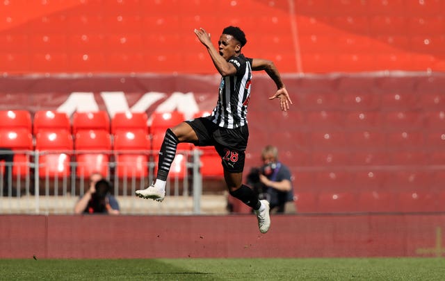 Newcastle's Joe Willock jumps for joy after securing a 1-1 draw at Liverpool with a stoppage-time equaliser