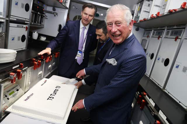 The Prince of Wales cuts a cake celebrating 10 years of Terminal 5 (Chris Jackson/PA)