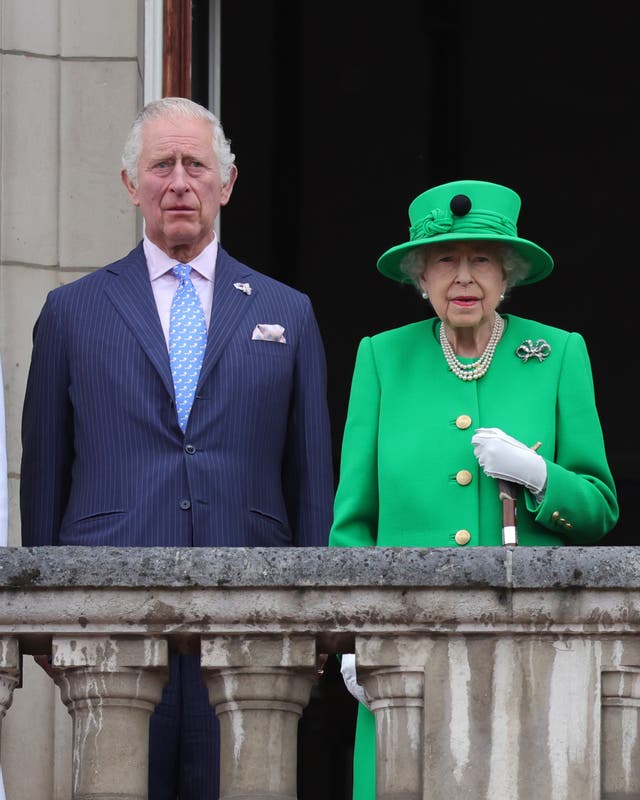 The then-Prince of Wales stands next to Queen Elizabeth II on the Palace balcony during the Platinum Jubilee celebrations