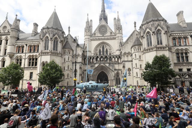 Protesters from Extinction Rebellion outside the Royal Courts of Justice in London 