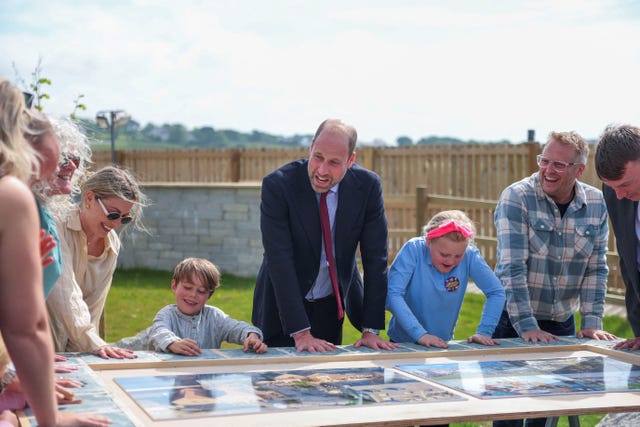The Prince of Wales leaves his handprints in Nansledan 