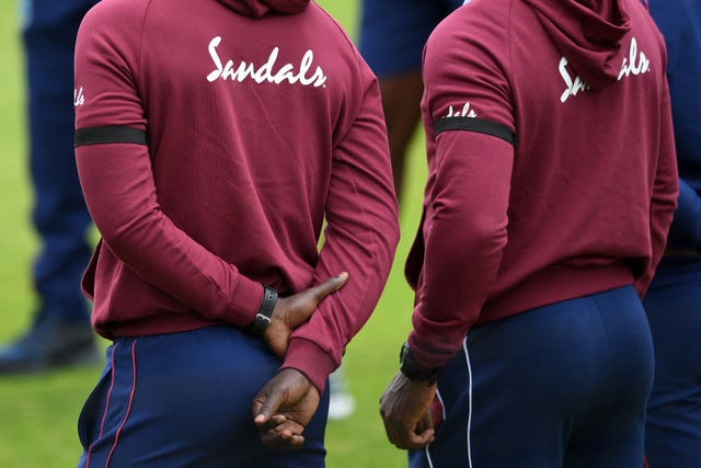 Players wearing black armbands in memory of former West Indian Batsman Sir Everton Weekes 