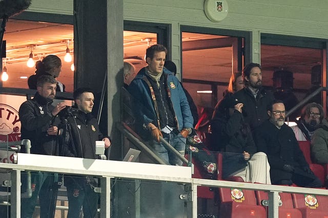 Ryan Reynolds watches on