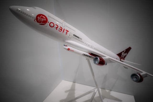 A scale model of Cosmic Girl showing how the rocket will be carried under the wing of the plane (Ben Birchall/PA)