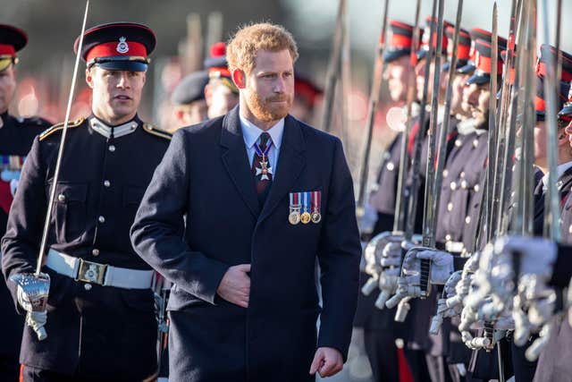 Prince Harry inspects the graduating officer cadets at the Royal Military Academy in Sandhurst in December 2017 (Richard Pohle/The Times/PA)