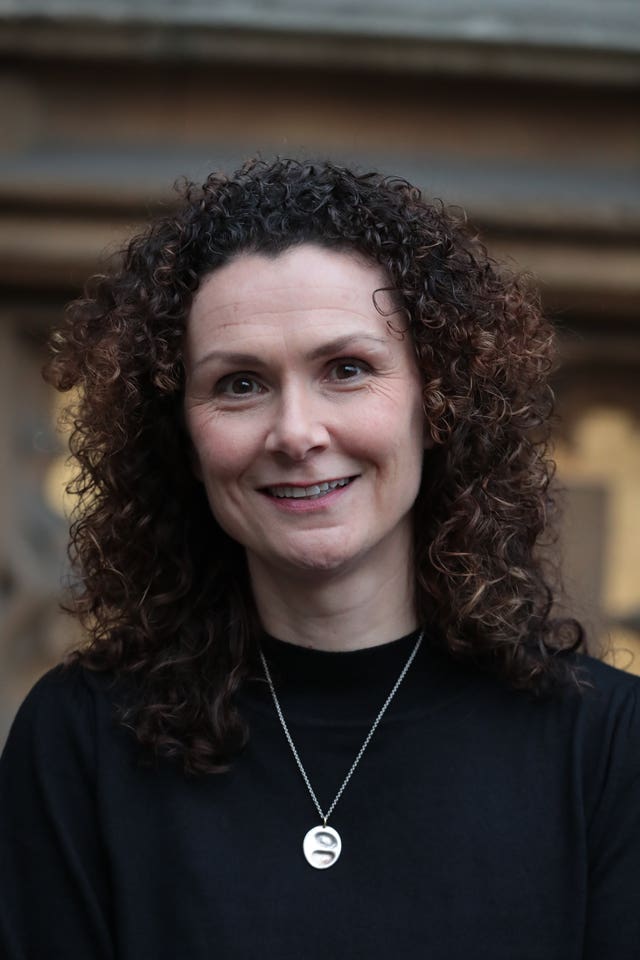 Wendy Chamberlain, dressed in a black top, smiling at the camera