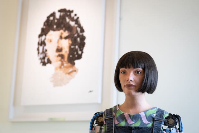 Ai-da the robot near her self portrait in June