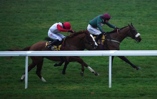 Fiercely Proud ridden by Luca Morgan (right) wins The JCB “Junior” National Hunt Flat Race at Cheltenham Racecourse