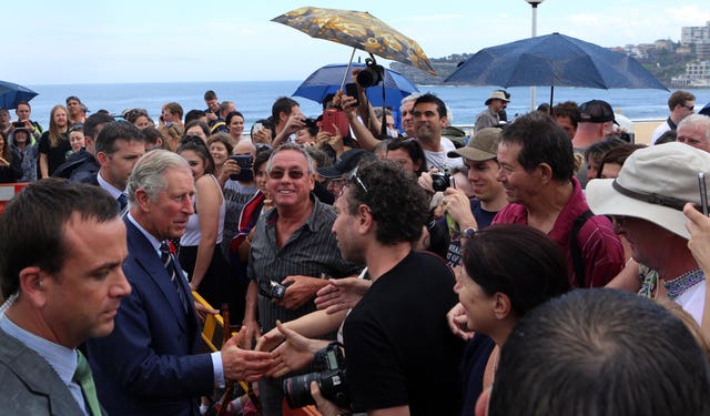 Charles is greeted by wellwishers as he arrives to watch the Australian National Rugby League's Dream Believe Achieve mentoring programme in action at the Bondi Beach Surf Lifesaving Club in Sydney in 2012