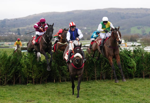 Back On The Lash ridden by Sean Bowen (centre) clears a fence before going on to win the Glenfarclas Cross Country Handicap Chase during Festival Trials Day at Cheltenham Racecourse