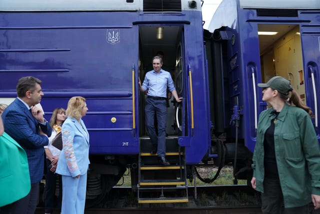 Mr Harris arrives by train at Nemishaieve station 