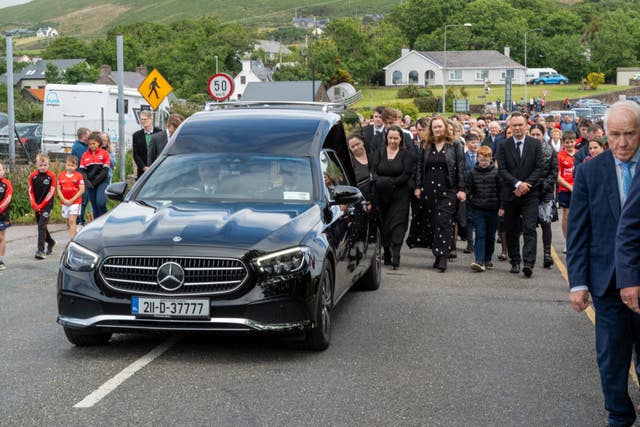 The hearse carrying renowned Gaelic games commentator Micheal O Muircheartaigh following his funeral at St Mary’s Church in Dingle, Co Kerry 