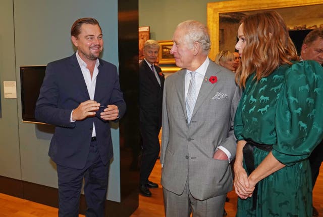 The Prince of Wales speaks with designer Stella McCartney and Leonardo DiCaprio (Owen Humphreys/PA)