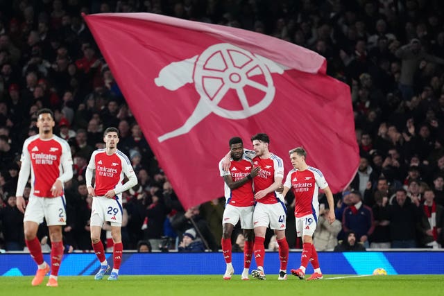 Thomas Partey (centre left) celebrates scoring their side’s second goal 