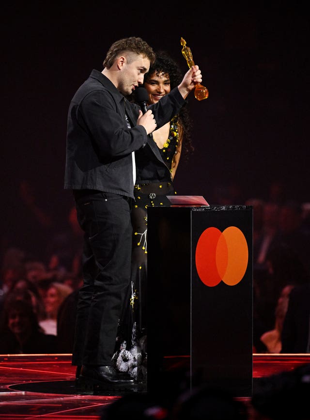 Sam Fender (left) with Olivia Dean during the Brit Awards