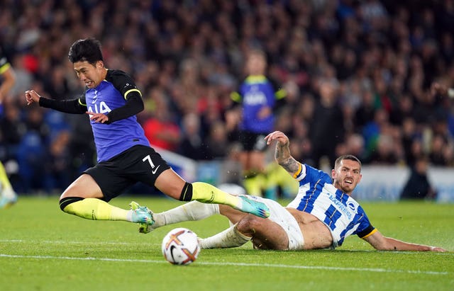Lewis Dunk (right) tackles Son Heung-min