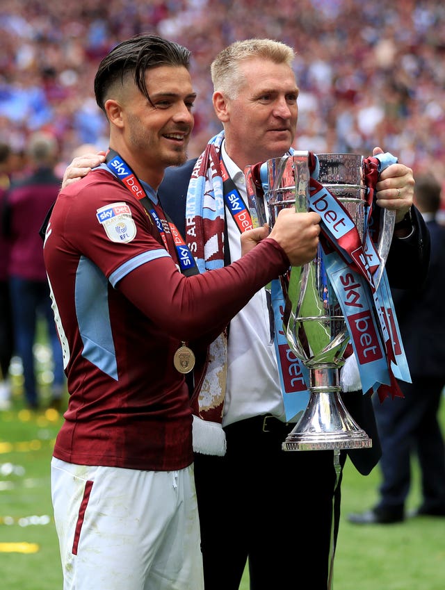 Smith (right), pictured alongside Jack Grealish, led Villa to promotion via the play-offs