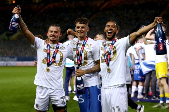 Ben White (centre) won promotion with Leeds
