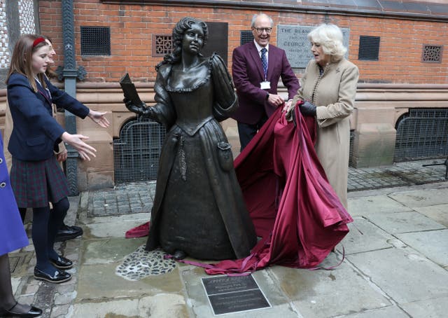 Camilla unveiling a life-size bronze statue of Aphra Behn