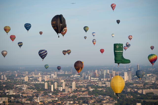 Hot air balloons fly over London