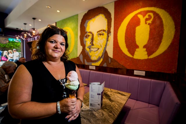 Daniela Morelli, of ice cream shop Morelli’s in front of a special commissioned art piece of the 2018 The Open winner Francesco Molinari using 20kg of ice-cream sprinkles