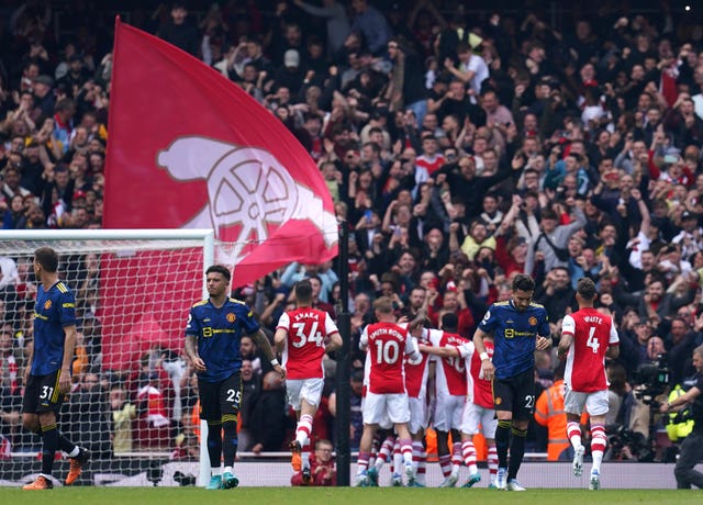 Arsenal celebrate a goal against Manchester United 