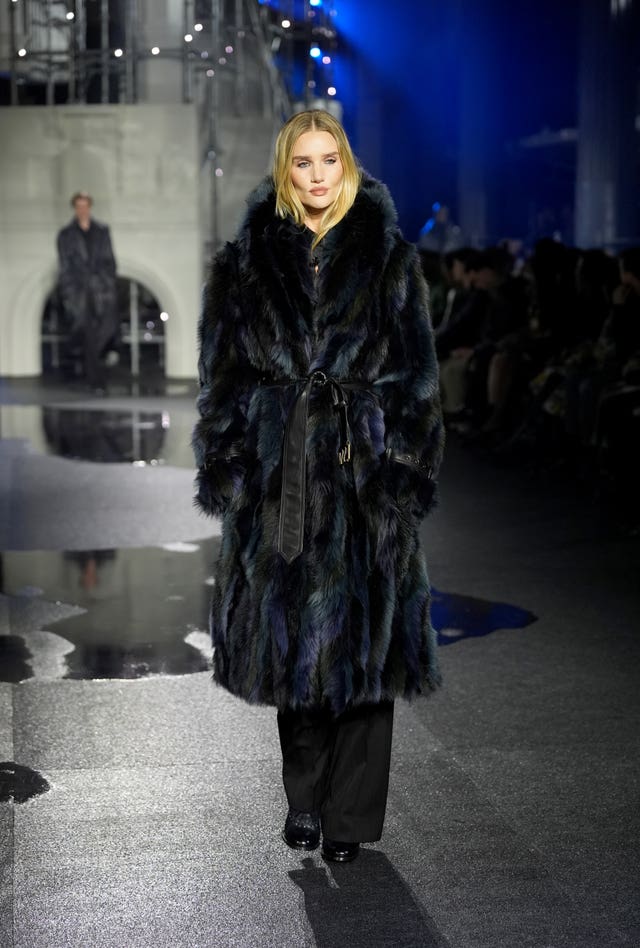 Rosie Huntington-Whiteley in a long blue-black fur coat at London Fashion Week