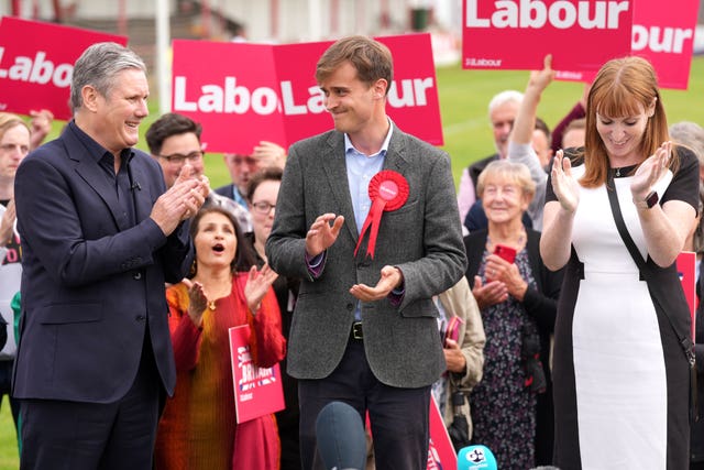 Newly elected Labour MP Keir Mather, centre, with Labour leader Sir Keir Starmer and deputy Labour Party leader Angela Rayner at Selby football club in North Yorkshire