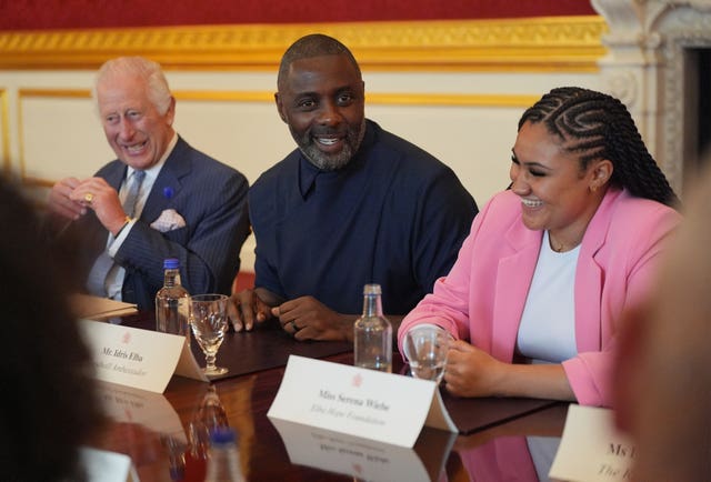 The King, Idris Elba and Serena Wiebe, of the Elba Hope Foundation, attending an event for The King’s Trust to discuss youth opportunity at St James’s Palace in central London