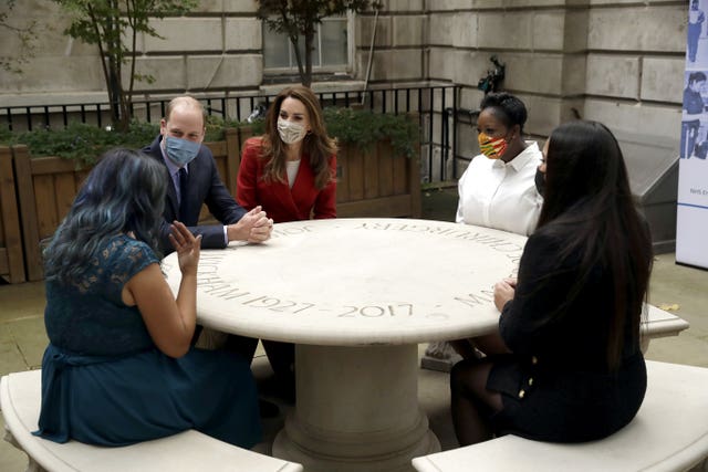 The Duke and Duchess of Cambridge meet pharmacist Joyce Duah (second right), and pharmacy technicians Amelia Chowdhury (right) and Dipal Samuel (left). Matt Dunham/PA Wire