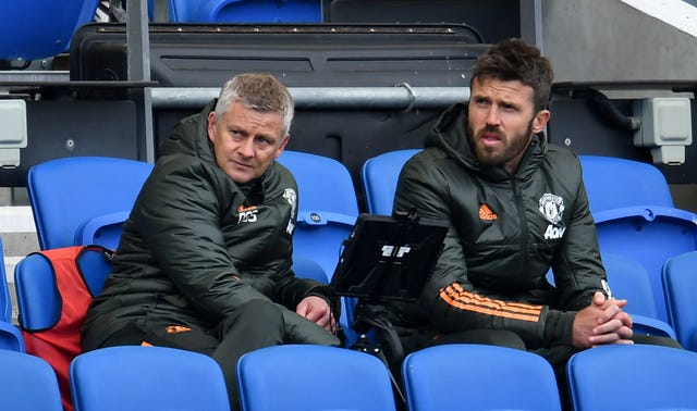 Ole Gunnar Solskjaer (left) and Michael Carrick in the dugout