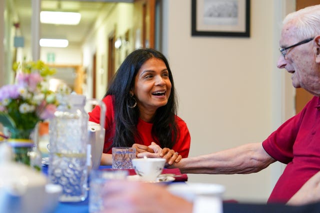 Akshata Murty talks to a resident at a Royal British Legion centre