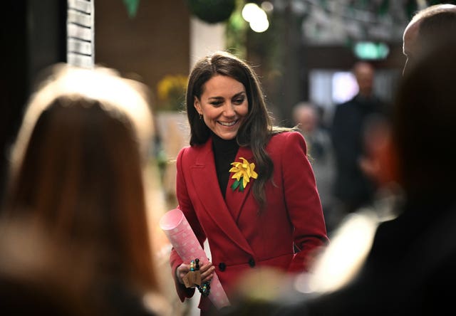 The Princess of Wales smiles during a visit to Pontypridd Market in Wales to talk to local business owners about the impact of the flooding caused by Storm Bert and Storm Darragh, and help prepare and cook a batch of Welsh cakes at the The Welsh Cake Shop