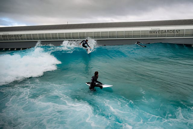 People surfing at The Wave in Bristol