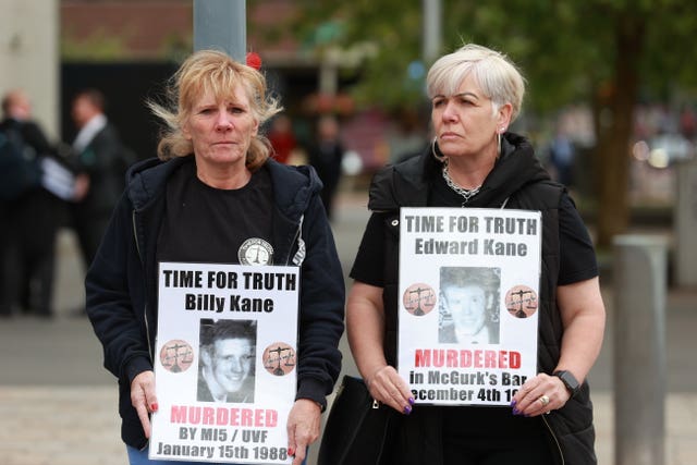 Demonstrators holding up posters calling for justice for Billy Kane and Edward Kane