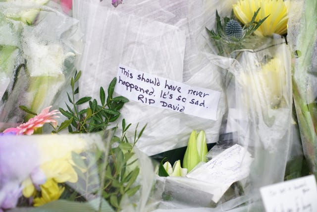 Flowers and tributes at the scene near Belfairs Methodist Church in Eastwood Road North, Leigh-on-Sea, Essex, where Conservative MP Sir David Amess died