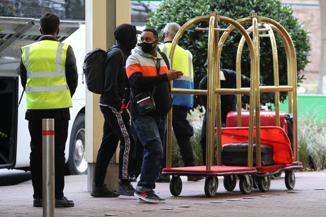 A passenger entering quarantine arrives at the Holiday Inn hotel, near Heathrow Airport, London