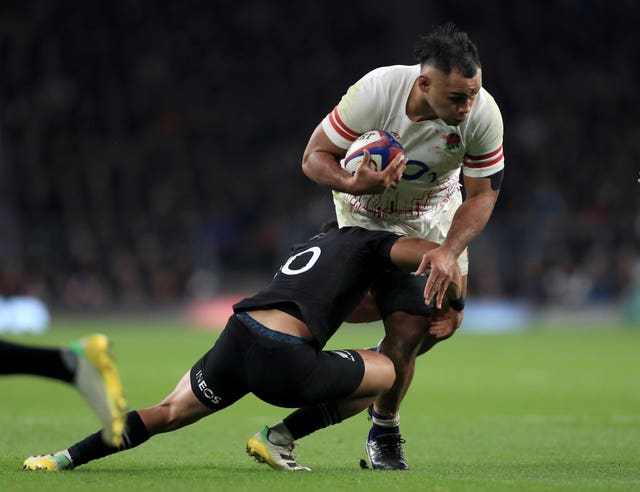 Billy Vunipola, right, is tackled by New Zealand’s Richie Mo’unga