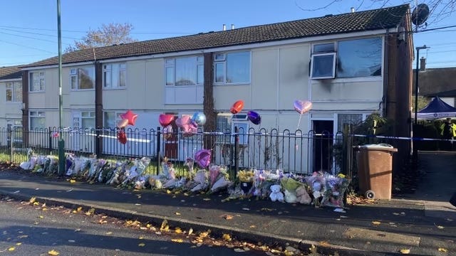 Several floral tributes were left outside the flat in Fairisle Close after the fire last November (Nottinghamshire Police/PA)