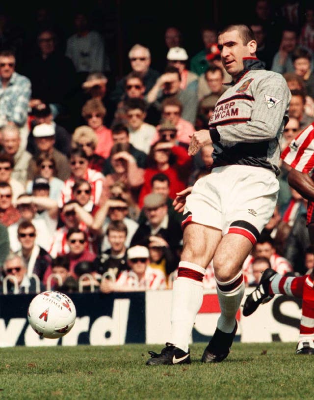 Eric Cantona wearing the grey shirt which Manchester United changed at half-time 