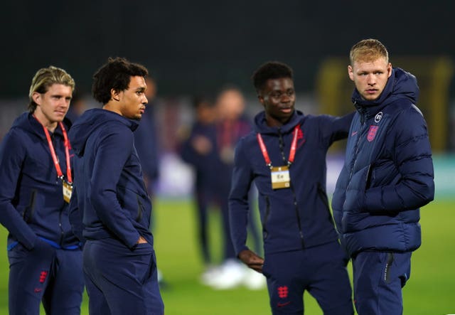 England’s Conor Gallagher, Trent Alexander-Arnold, Bukayo Saka and goalkeeper Aaron Ramsdale inspect the pitch before the World Cup qualifying match in San Marino in November 2021 