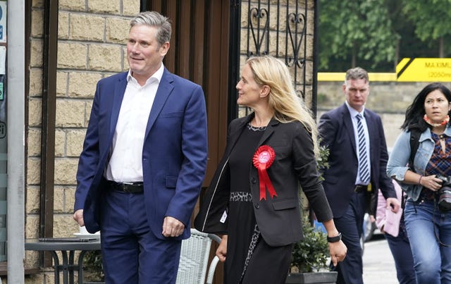 Labour party leader Sir Keir Starmer walks with Kim Leadbeater who kept Batley and Spen Labour after fending off challenges from the Tories and George Galloway (Peter Byrne/PA)