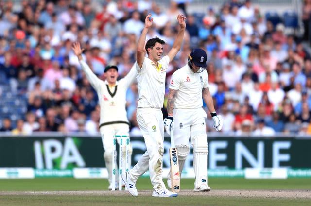 Pat Cummins, centre, celebrates the wicket of Ben Stokes