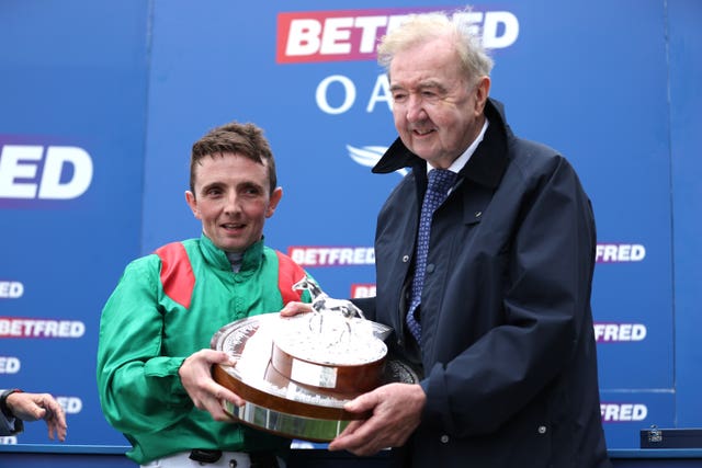 Jockey Chris Hayes (left) and trainer Dermot Weld with the Oaks trophy