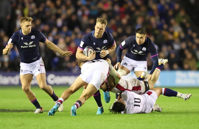 Scotland’s Duhan van der Merwe, centre, is tackled by England’ Henry Slade